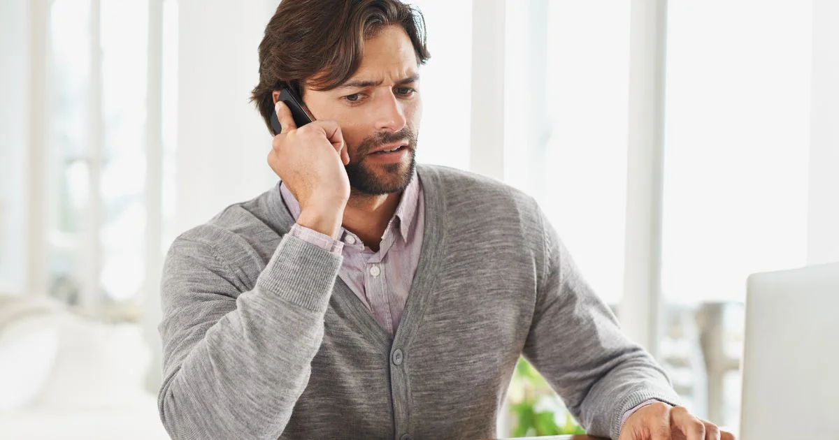 Man concerned during phone call over unexpected costs